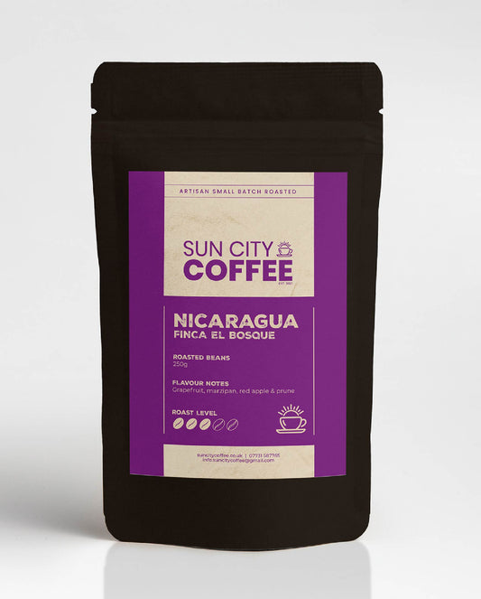 A pack of Sun City Coffee Nicaragua Finca El Bosque single origin coffee with bright purple label and black bag